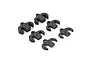 A set of six small carbon fibre shim plates for RC car body mounts, arranged on a white background.