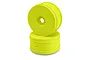 Two bright yellow JConcepts dish-style RC buggy wheels stacked on a white background.