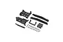 A collection of black plastic RC chassis parts and small metal screws laid out on a white background.