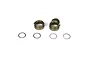 Two TLR aluminium rear gearbox bearing inserts and four thin metal shims arranged on a white background.