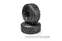 Two JConcepts Tusk crawler tyres stacked on a white background, showing aggressive tread patterns and sidewall branding.