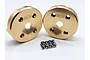 Two circular brass portal covers for RC vehicles with the Reefs RC logo engraved, accompanied by a set of small metal screws on a white background.