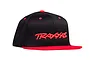 A black Traxxas flat bill snapback cap with red embroidery and a red brim against a white background.