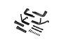A set of matte black scale RC exhaust headers, mounting plates, and small screws arranged on a white background.