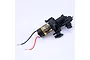 FMS 550 brushed motor attached to a black plastic transmission gearbox assembly with red and black wires.