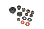 A set of various metal RC transmission gears, washers, and red friction pads arranged on a white background.