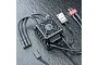 MST XBL 60A brushless electronic speed controller with cooling fan, power wires, and switch on a textured black surface.