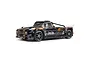 ARRMA Infraction 3S BLX RC truck in black and brown livery with street tires on a white background.