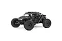 ARRMA Fireteam 6S BLX Speed Assault Vehicle in matte black camo finish, featuring a detailed roll cage, off-road tires, and three scale driver figures.