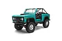 Turquoise blue Axial SCX10 III Early Ford Bronco RC rock crawler on a white background.