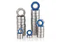 A collection of various sized metal ball bearings with blue rubber seals stacked in groups against a white background.