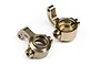 Two gold-anodized aluminium steering hubs for RC cars, shown from a high angle against a white background.