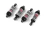 A set of four RC car shock absorbers with red bodies, black plastic ends, and white coil springs against a white background.