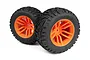 Two Maverick 2.8 inch MixBlok monster truck tyres pre-glued onto bright orange multi-spoke plastic rims, shown against a white background.