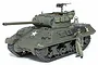 A fully assembled and painted 1/35 scale Tamiya M36 U.S. Tank Destroyer model kit with a crew figure standing beside it on a white background.