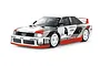 A Tamiya TT-02 Audi 90 Quattro RC car kit, fully assembled with white, grey, and red racing livery and number 4 decals on a white background.