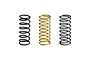 Three RC shock springs standing upright, two black and one gold, against a white background.
