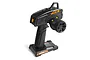 HPI Racing TF-51 2.4GHz 4-channel pistol-grip RC transmitter in black with orange accents, shown from a rear three-quarter angle.