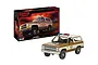 Revell 1/25 scale plastic model kit of the 1985 Chevrolet K5 Blazer from Stranger Things, featuring the Hawkins Police Department livery and packaging.