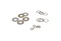 A collection of various metal washers and shims of different sizes arranged on a white background.