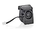 BetaFPV Aquila16 FPV camera module in a black plastic housing with a white connector cable, isolated on a white background.