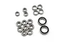 A collection of 17 metal ball bearings of various sizes arranged on a white background for the RC10T bearing kit.