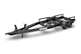 A studio shot of the black Traxxas Disruptor tandem axle RC trailer on a white background, showing the frame, wheels, and hitch assembly.