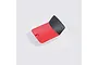 A red and black plastic battery cover for an RC plane, shown from a top-down perspective against a white background.