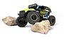 HPI Venture18 U4 Ford Bronco 4400 Flux RC rock crawler in black and neon yellow livery, climbing over two large rocks on a white background.