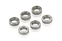 A set of five small metal shielded ball bearings arranged on a white background.