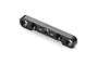 A black anodized aluminium suspension pin holder for RC cars, featuring a +3 marking and directional arrows.