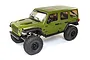 A green Axial SCX6 Jeep JLU Wrangler RC rock crawler viewed from a high angle against a white background.