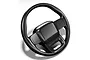 A black Bittydesign Rock1 steering wheel accessory for RC car bodies, shown in a studio product shot against a white background.