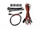 Traxxas boat trailer LED light kit including wire harnesses, zip ties, and adhesive cable mounts on a white background.