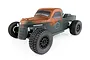 Team Associated Trophy Rat 1/10 scale RC trophy truck with a weathered, rusted-look olive green body, black wheels, and off-road tires.
