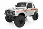Silver Element RC Enduro12 Bushido 1/12 scale RC rock crawler truck with black wheels and off-road tires on a white background.