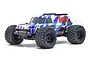 Kyosho Mad Wagon VE 1/10 scale RC monster truck with blue, white, and black graphic body shell and large off-road tires.