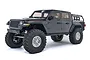 A grey Axial SCX10 III Jeep JT Gladiator RC rock crawler truck shown from a front three-quarter angle against a white background.