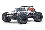 Kyosho Mad Wagon VE 1/10 scale RC monster truck in black and white livery with large off-road tires, viewed from a front three-quarter angle.