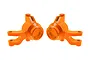 A pair of bright orange anodized aluminium steering hubs for an RC car, shown from a side-on perspective against a white background.