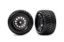 Two Traxxas Gravix RC tires on grey Mini XRT rims, shown from front and angled perspectives against a white background.