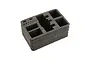 A black foam insert for a Spektrum transmitter case with pre-cut compartments for a radio and accessories.