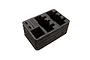 A black foam insert for a Spektrum transmitter case with pre-cut compartments for radio equipment.