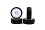 A set of four 1/10 scale RC touring car wheels with white spoked rims and black treaded rubber tyres.