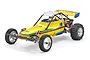 Kyosho 2014 Scorpion 1/10 scale 2WD electric RC buggy in yellow with a driver figure, rear wing, and off-road tires against a white background.
