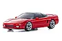 A studio shot of a red Kyosho Mini-Z Honda NSX RC car on a white background, showing the sleek sports car body and silver wheels.