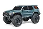 Axial SCX24 Toyota 4Runner RC rock crawler in grey, featuring large off-road tires, black wheels, and detailed decals on a white background.