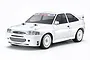 A white Tamiya 1/10 scale Ford Escort Custom RC car model on a white background, featuring rally-style wheels and Ford Motorsport branding.