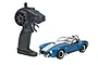 Kyosho First Mini-Z Shelby Cobra 427 S/C RC car in blue with white stripes, accompanied by its black pistol-grip radio transmitter.