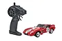 Kyosho First Mini-Z Shelby Cobra Daytona RC car in red with white racing stripes and number 59, shown with its black pistol-grip transmitter.